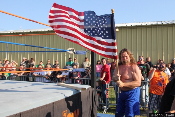 Hacksaw Jim Duggan with the American flag